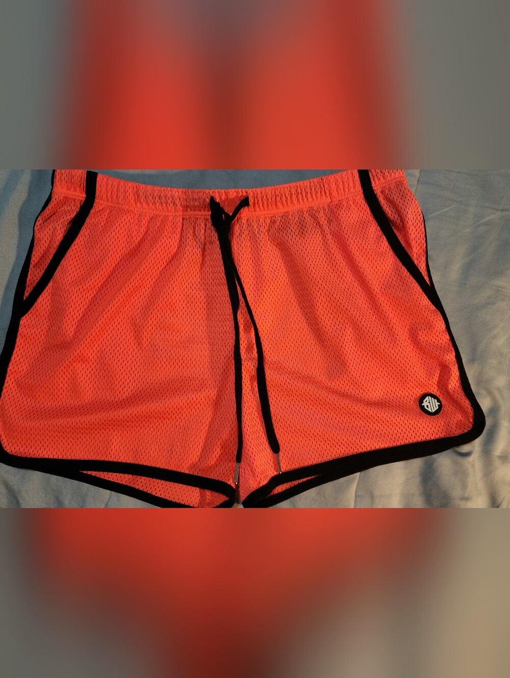 Men's Orange Athletic Mesh Shorts with Black Trim and Drawcord